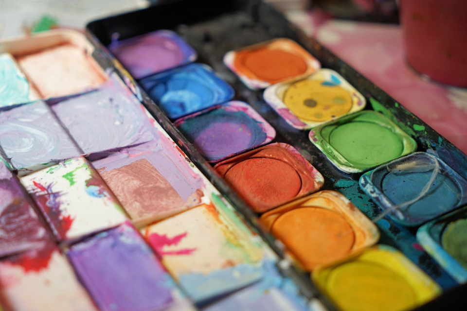 Teens creating art in an after-school workshop